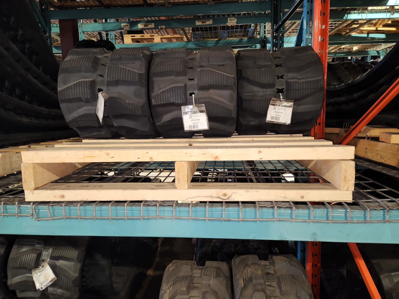 X-TRAC rubber tracks stocked on the racks at the new Calgary warehouse